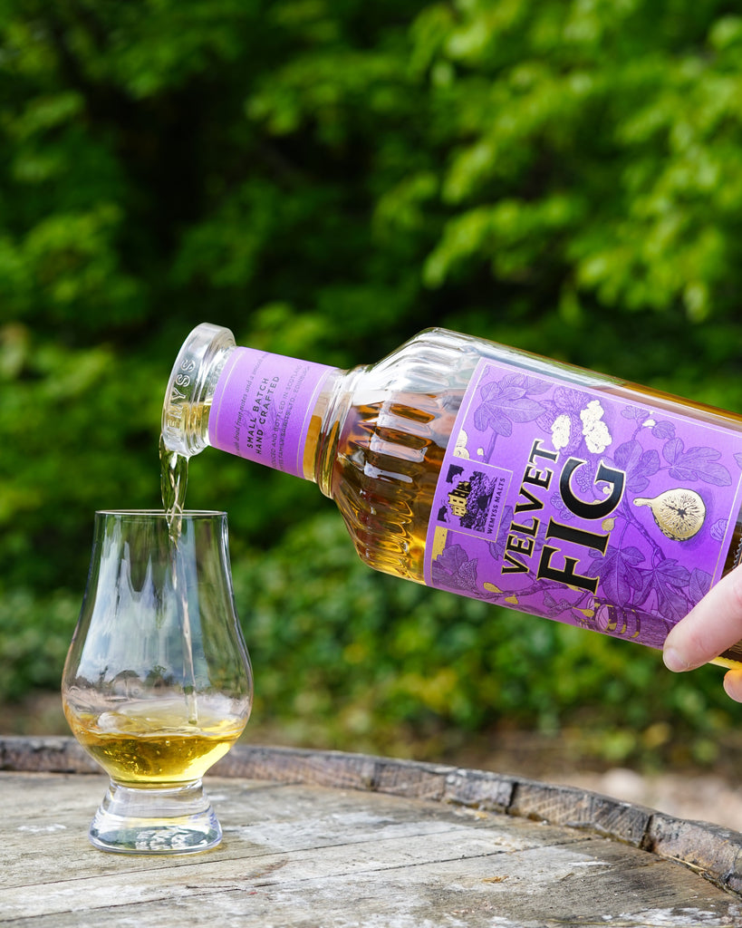 Velvet Fig whisky being poured into a Glencairn glass